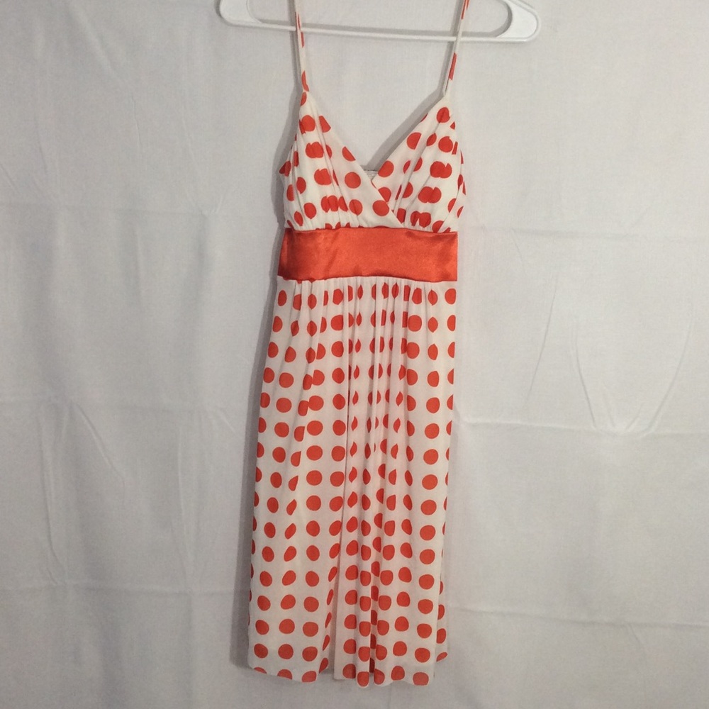 Sleeveless summer dress with orange polka dots